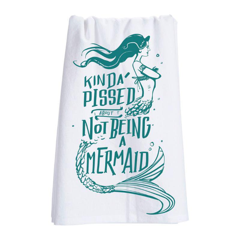 White towel with teal mermaid design and text on a white background