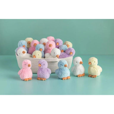 Pastel-colored plush ducks with a basket on a light blue background