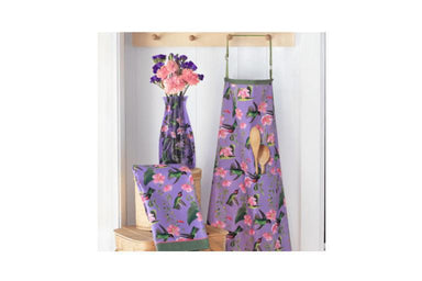 Floral aprons with a vase of flowers on a white background