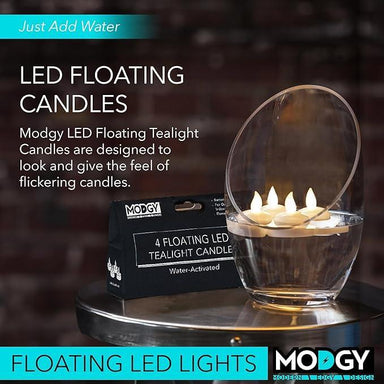 Modgy LED floating tealight candles with packaging on a reflective surface.