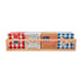 Set of napkins with American-themed designs in a wooden holder on a white background