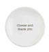 Round white plate with 'Cheese and thank you' text on a white background