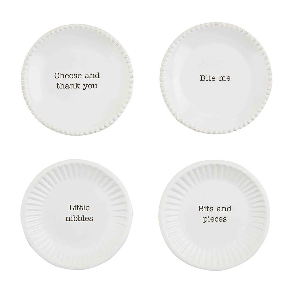 Four white plates with humorous text on a white background