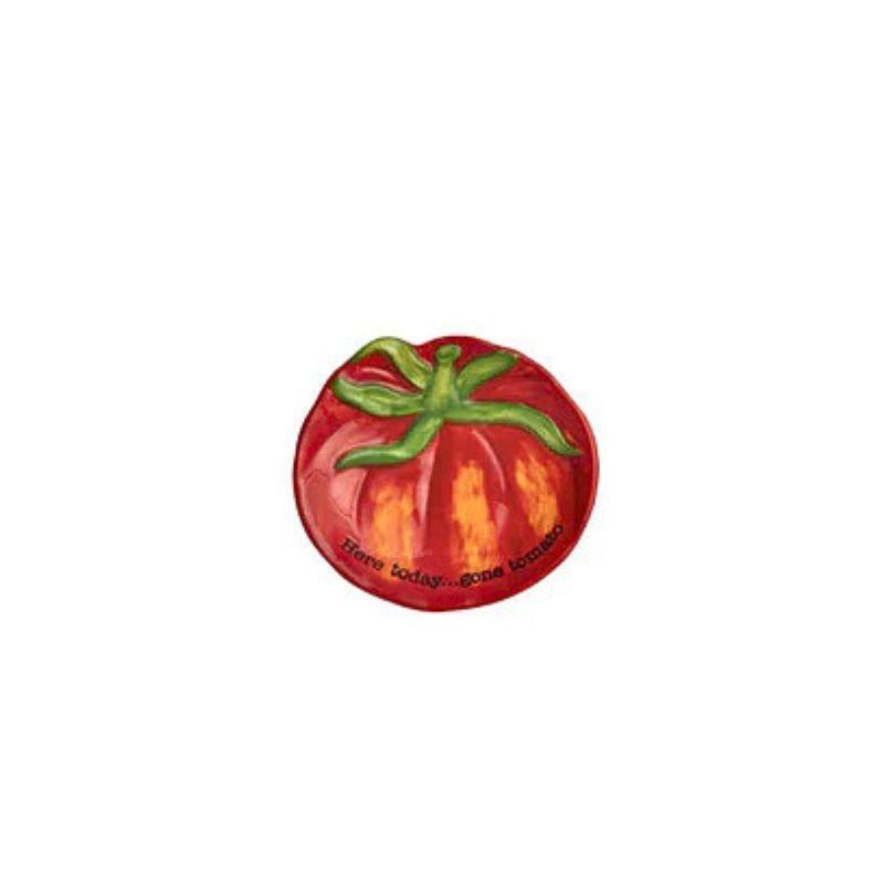 Red tomato-shaped Dish with green leaves on a white background