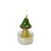 Mushroom-shaped candle with a small flame in a glass holder on a white background
