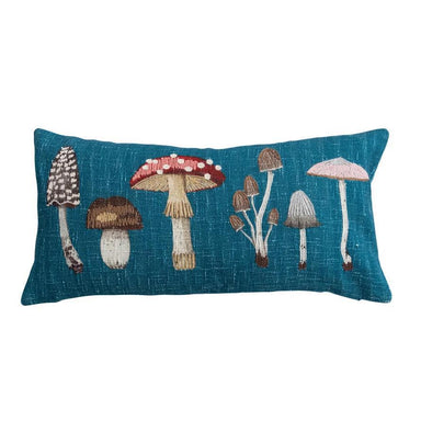 Decorative pillow with embroidered mushrooms on a blue background