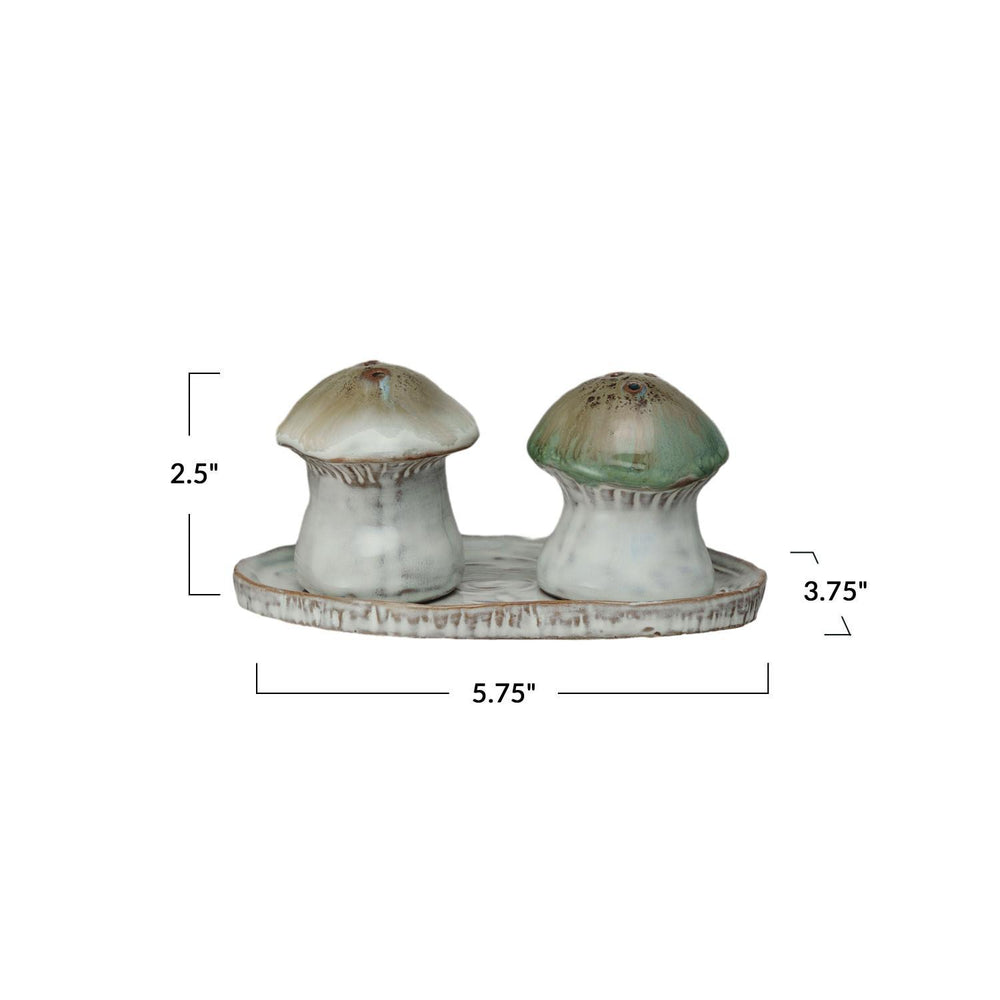 Mushroom-shaped salt and pepper shakers on a tray with measurements