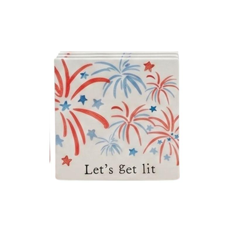 Napkins with firework design and 'Let's get lit' text on a white background