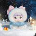 Toy figure in winter clothing with a snowy background