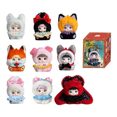 Set of plush toys with colorful outfits and a box labeled 'Fairy Tale Town' on a white background.