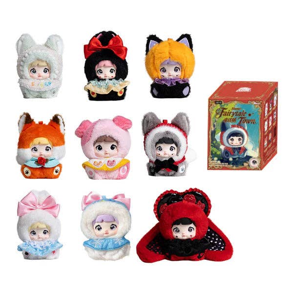 Set of plush toys with colorful outfits and a box labeled 'Fairy Tale Town' on a white background.