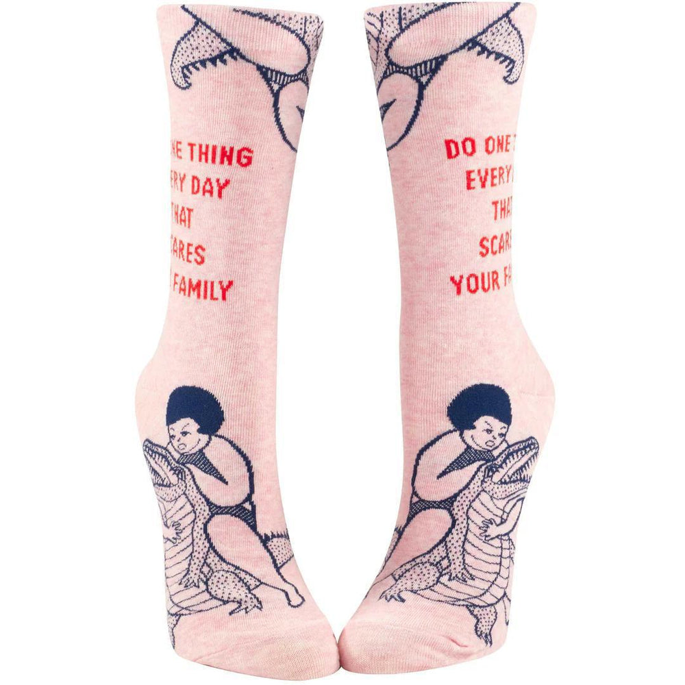 Pink socks with graphic designs and text on a white background