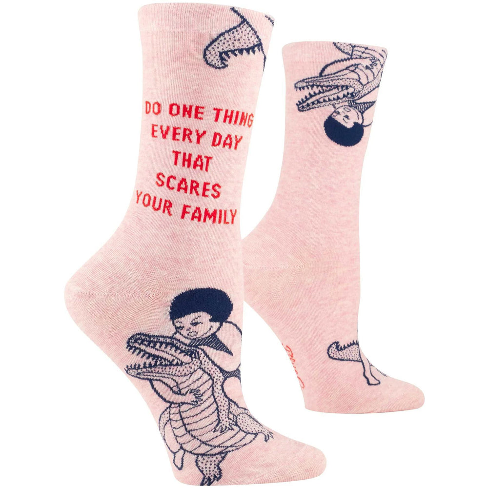 Pink socks with alligator design and text on a white background
