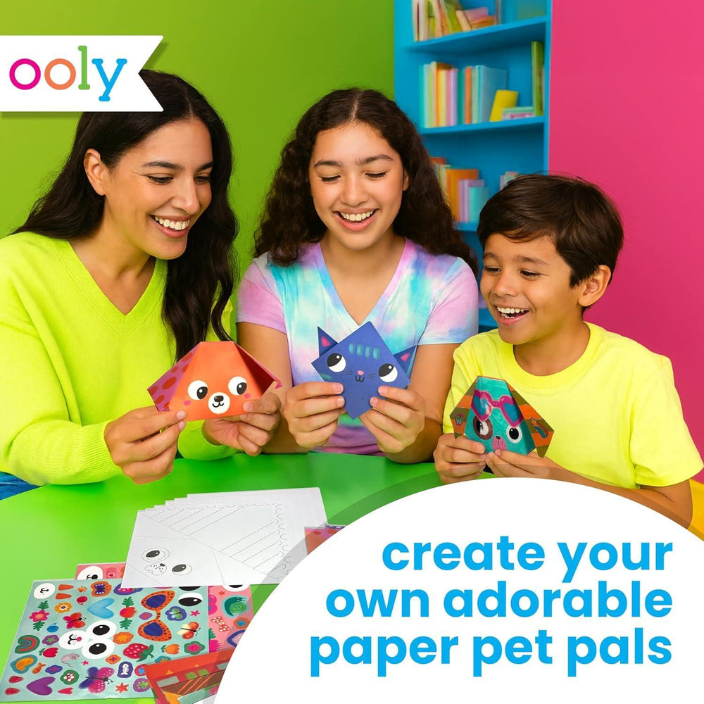 Three children and a woman creating paper pet toys with colorful backgrounds and 'ooly' branding.