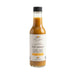 Bottle of hot sauce with a white label on a white background