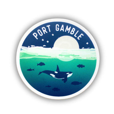 A circular sticker featuring an illustrated underwater scene with an orca, fish, a white moon, and the text 'PORT GAMBLE' at the top, shown on a white background.