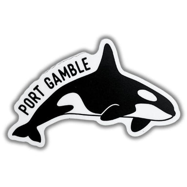 A die-cut sticker featuring a black and white orca illustration with the text 'PORT GAMBLE' in black lettering along the top curve, shown on a plain white background.