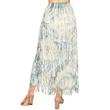 Long, patterned skirt with fringe on a white background