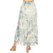 Long, patterned skirt with fringe on a white background