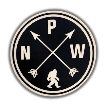 A circular black and off-white sticker or patch featuring the letters N, P, and W arranged around two crossed arrows and a small walking figure silhouette at the bottom, shown on a white background with a soft drop shadow.