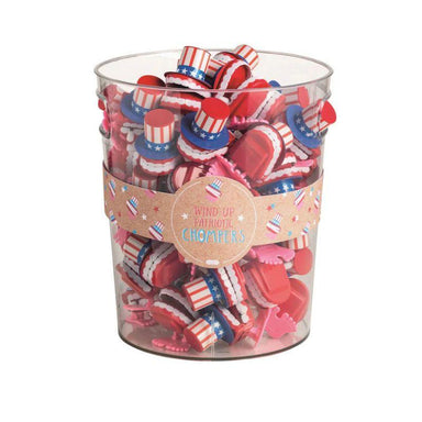 Clear container filled with small American flag-themed wind-up toys on a white background
