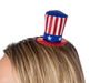 Red, white, and blue top hat on a person's head against a white background