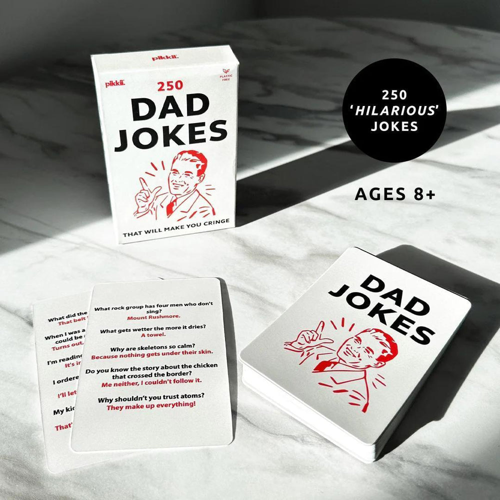 Card game box for '250 Dad Jokes' on a marble surface