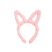 Pink bunny ear headband on a white background