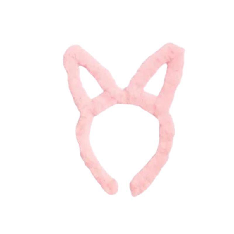 Pink bunny ear headband on a white background