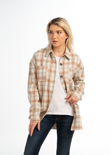 Woman wearing a plaid shirt over a white top and jeans on a white background