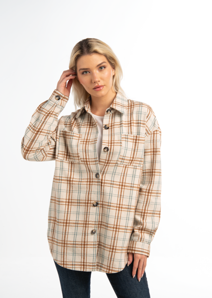 Woman wearing a plaid shirt on a white background