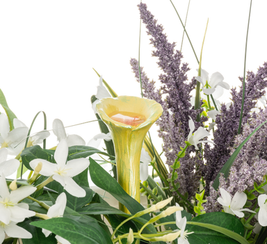 Floral arrangement with white flowers, a yellow calla lily, and purple lavender.