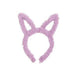 Purple fluffy bunny ears headband on a white background