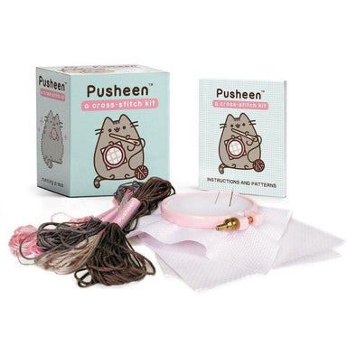 Pusheen cross-stitch kit with materials on a white background