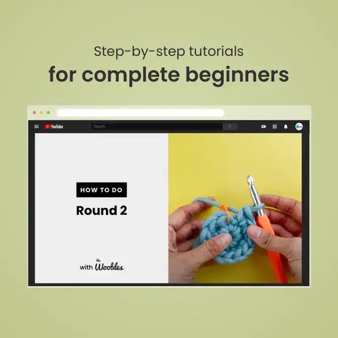 Crocheting tutorial on a computer screen with text 'Step-by-step tutorials for complete beginners' on a green background.