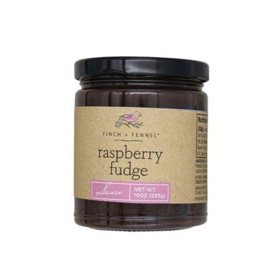 Jar of raspberry fudge with a brown label on a white background