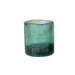 Green glass candle holder on a white background