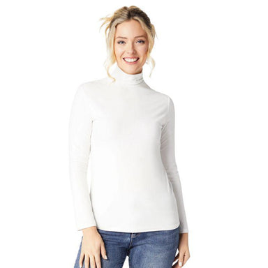 Woman wearing a white turtleneck sweater and blue jeans on a white background