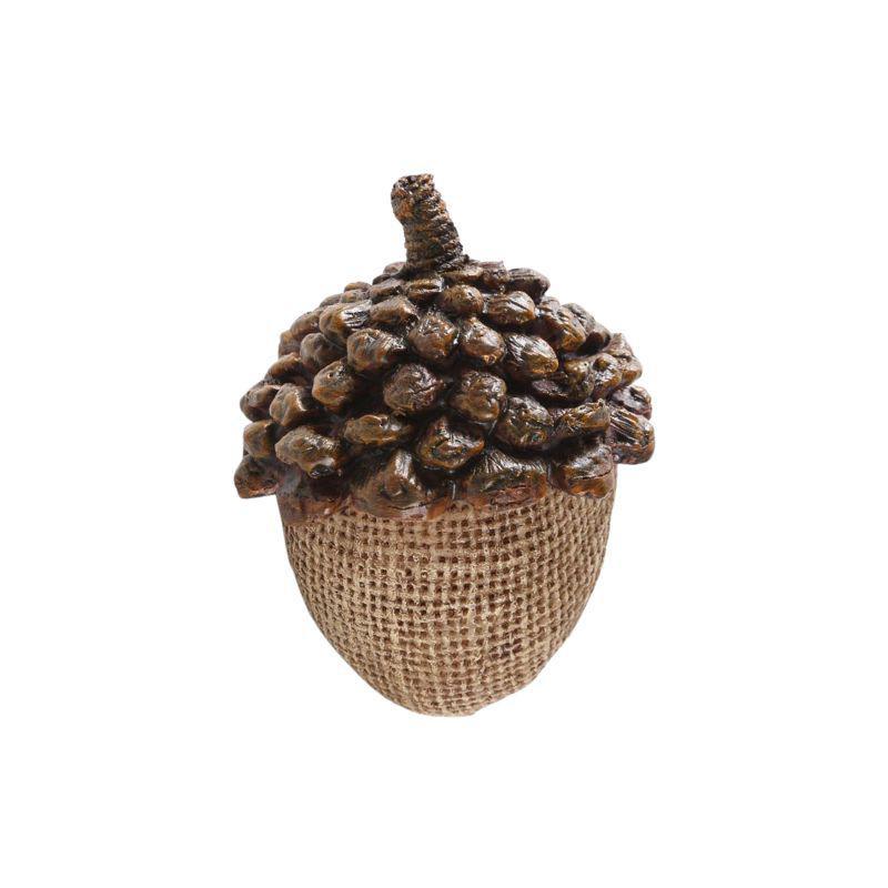 Decorative acorn with textured surface on a white background