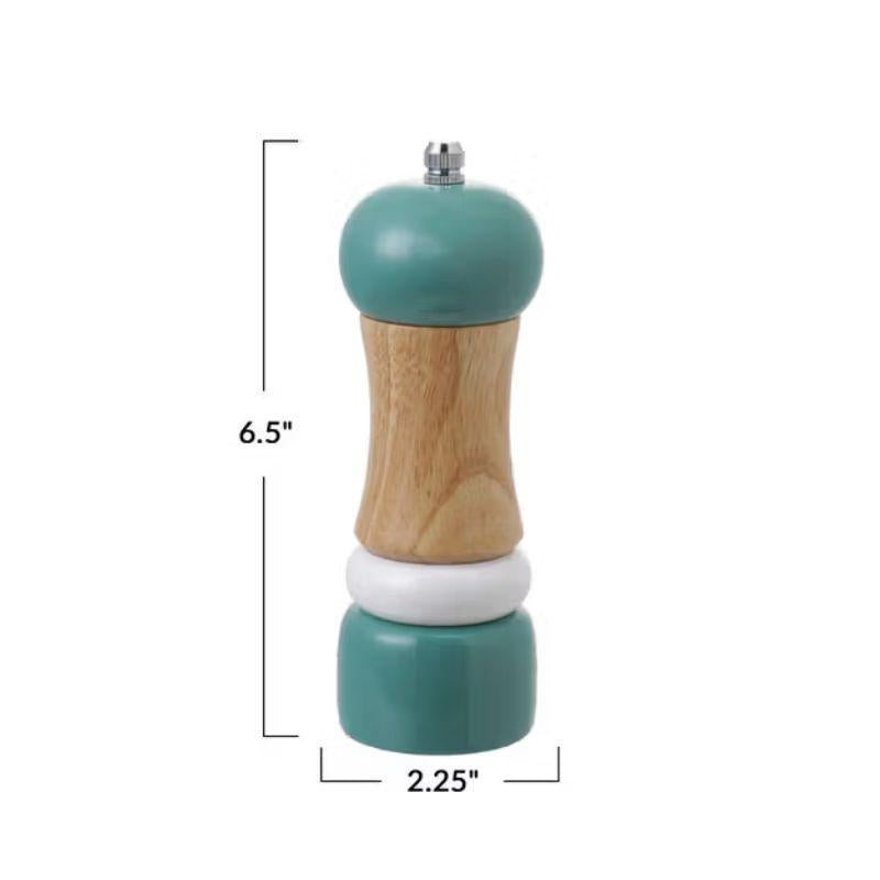 Teal and wooden pepper grinder with measurements on a white background