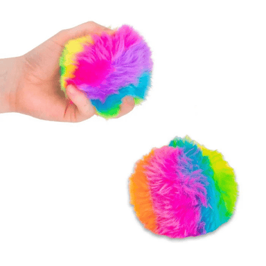 Colorful fluffy ball held in a hand with another ball on a white background