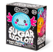 Scrunchems Sugar Axolotl toy packaging box, featuring a black background with a large blue glittery axolotl illustration, pink gills, and colorful axolotl faces on the side panels.