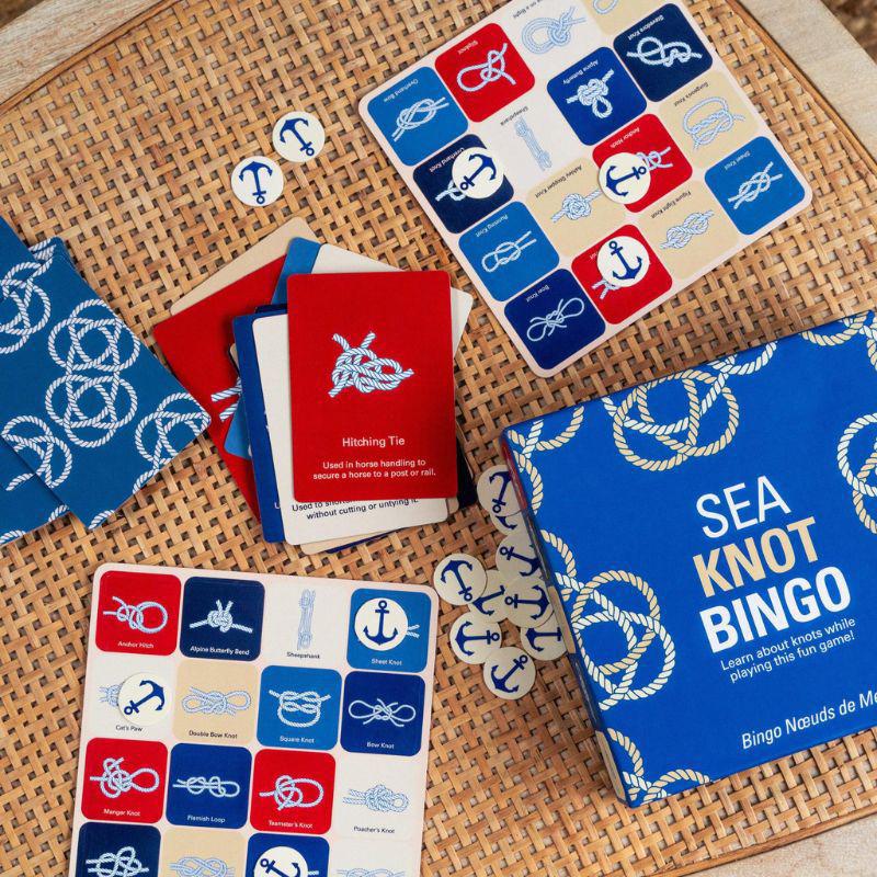 Sea Knot Bingo game components on a woven surface