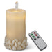 Flickering candle with seashell design and remote control on a white background