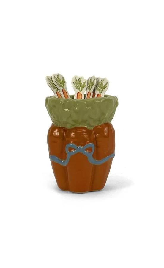 Ceramic container with a green lid and brown body on a white background
