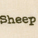 Text 'Sheep' embroidered on a beige fabric background