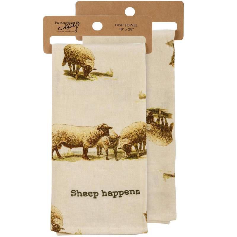 Two dish towels with sheep design and 'Sheep happens' text, in packaging.