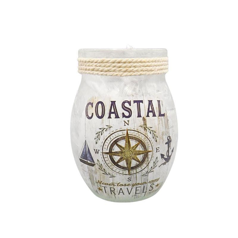 Decorative jar with nautical design and 'Coastal Travels' text on a white background