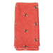 Red fabric with bee patterns on a white background