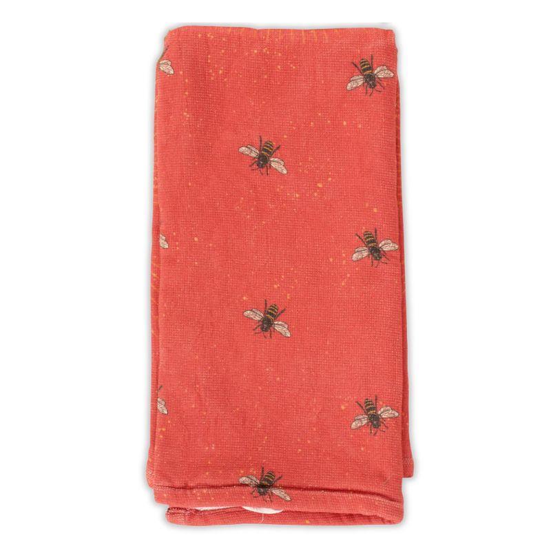 Red fabric with bee patterns on a white background